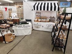 an indoor market area with tables, baskets and other items