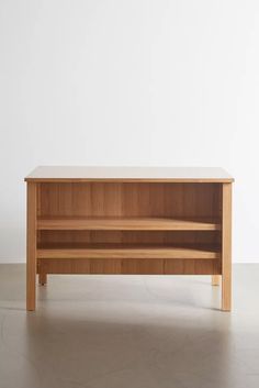 a wooden shelf sitting on top of a floor