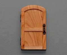 a wooden door is mounted on the wall