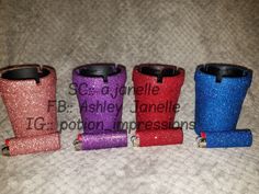 four different colored glittered rain boots are on the bed with their name written on them