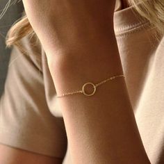 14K Solid Gold Karma Bracelet * Small Ring Bracelet * Delicate Open Circle Bracelet * Eternity Bracelet * Layering Bracelet * Simple PRODUCT DESCRIPTION Our modern everyday Vogue bracelet features a karma circle on a stunning dainty chain. Simple and minimal and the perfect go-to piece. Soft colours and a high quality piece. DETAILS & MATERIALS * Sterling Silver, 14K Gold Filled, 14K Rose Gold Filled & 14K Solid Gold materials. * 10mm circle. * Circles available in smooth or hand hammered finish Minimalist Round Gold Bracelet For Everyday, Modern Circle Bracelets For Everyday Wear, Minimalist Pink Round Bracelet, Dainty Adjustable Circle Bracelets, Minimalist 14k Gold-filled Round Bracelets, Eternity Bracelet, Karma Bracelet, Circle Bracelet, Simple Bracelets