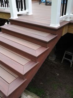 a set of wooden steps leading up to a house