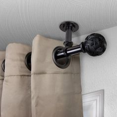 the curtain rod is attached to the wall