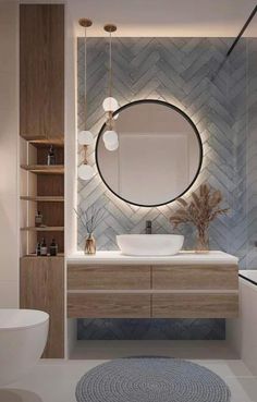 a bathroom with a round mirror above the sink and a rug on the floor next to it