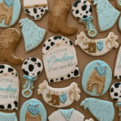 decorated cookies are arranged in the shape of cowboy boots, boots and cowgirls