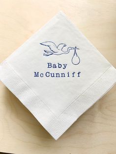 a napkin with a stork on it that says baby mccunni f