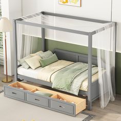 a bed with two drawers underneath it