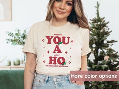 You A Ho Funny Shirt , HO HO HO T shirt, Christmas Pun Shirt, Funny Christmas Shirt, Santa's Hos Tee, Funny Santa tshirt, Ho Ho Ho shirt Ho ho ho! This funny Christmas shirt is perfect for anyone who wants to spread some holiday cheer this season. Whether you're celebrating Christmas or just looking for a punny shirt to wear, this shirt is sure to put a smile on your face.  ♡ TEE DEETS:  * Unisex Adult Sizing * 100% Soft Airlume combed and ring-spun cotton (Heather Colors are 52% Airlume combed and ring-spun cotton & 48% polyester) * Lightweight  * Tear away label *Rolled sleeves in photos are for styling purposes only, but sleeves are long enough to be stylishly rolled up. * Any props used in our photos are for styling only and NOT included with the purchase * All designs are chosen with Calling All You Ho Ho Hos, Punny Shirt, Santa Tshirt, Christmas Puns, Pun Shirts, Funny Santa, Celebrating Christmas, Funny Christmas Shirts, Rolled Sleeves