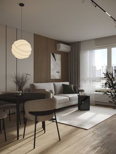 a living room filled with furniture next to a window covered in sheer curtains and lights