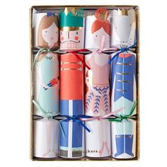 a box filled with different types of wrapped gift wrapping paper in it's packaging