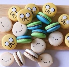 some macaroons with faces painted on them