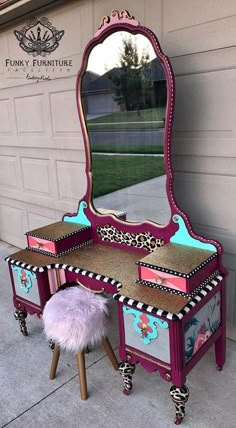 a vanity with stool and mirror in front of a garage