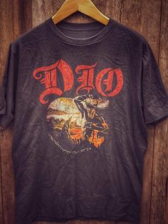 DIO 100% Cotton New Vintage Band T Shirt (Front View) - Vintage Band Shirts Dio Band, Types Of Cotton Fabric, Vintage Band Shirts, Vintage Band T Shirts, Shirt Wrinkles, Black Backdrops, Vintage Band, Band Shirts, The Deal