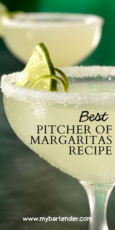 the best pitcher of margaritas recipe in a martini glass with lime garnish