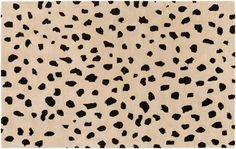 an animal print rug with black spots on it