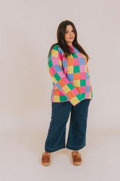 Fashionably transition between seasons in this vibrant PLUS SIZE - Between Places Sweater! With its cheerful multi-colored checker pattern, ribbed neckline, and pullover style, you can make a statement while staying comfortable. Details Multi-color blocked checker pattern Pullover sweater Ribbed neckline Colors are pink, blue, lime, orange, and green Sizing *Measurements are taken unstretched with item hanging* Approximate measurements: SIZE LENGTH BUST 1XL 29.5" 54" 2XL 30" 56" 3XL 30.5" 58" Fa Nursing Friendly Tops, Nursing Friendly Dress, Plus Jumpsuit, Checker Pattern, Plus Size Sweater, Exclusive Dress, Orange And Green, Plus Size Sweaters, Basic Dress