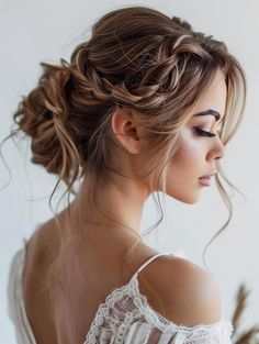 a woman with long hair wearing a white top and braid in her hair, looking off to the side