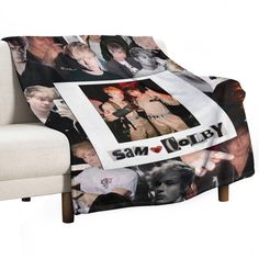 a chair with a blanket on it that has photos of the same person and their name