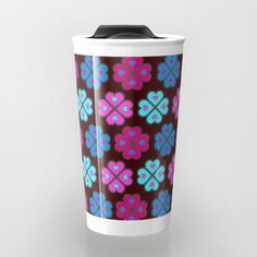 a coffee cup with an abstract design on the front and side, in blue, pink, and purple colors