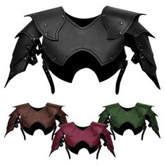 four different colors of leather bat wings with spikes on each side and two black, one red