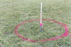 a red marker in the middle of a circle with a stick sticking out of it