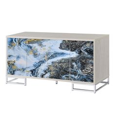 the sideboard is decorated with blue and gold marbled material, including metal legs