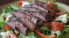 the steak salad is prepared and ready to be eaten