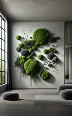 a living room filled with lots of furniture and green moss covered rocks on the wall