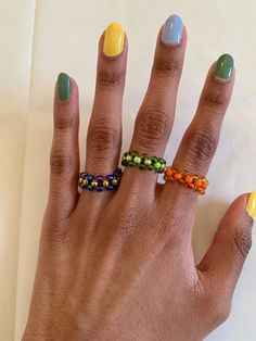 A cute beaded checkerboard ring that adds a pop of color to your daily outfits! Center Color: the color bead that goes in the middle of the pattern Outer color: the color beads that go on the outside of the pattern (around the center bead) Trendy Multicolor Beaded Ring, Seed Bead Rings Diy, Beaded Rings Patterns, Bracelet Stuff, Beading Bracelets, Pattern Outer, Easy Valentine Crafts, Bead Rings, Diy Beaded Rings