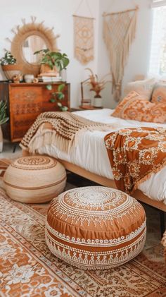 a bed room with a neatly made bed and lots of pillows on top of it