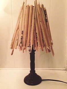 a lamp made out of sticks on a table