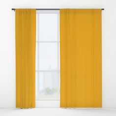 a yellow curtain hanging in front of a window