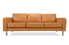 a tan leather couch with wooden legs and armrests on an isolated white background