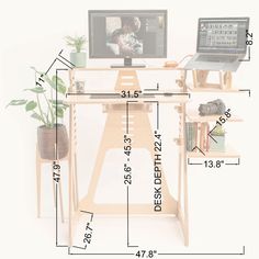 a computer desk with a laptop on it and measurements for the height of the desk