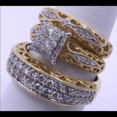 two gold rings with white diamonds on them