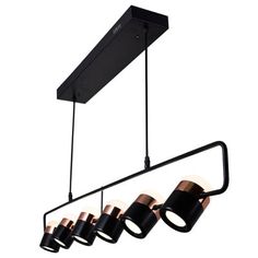 four lights hanging from the ceiling with black and copper shades on them, along with an overhead light fixture