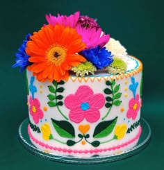 there is a decorated cake with flowers on it