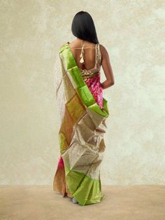 Embrace traditional elegance with our Pink and Green Fancy Patola Saree from the Sarees collection. This exquisite saree features a stunning combination of pink and green colors in a fancy Patola design, exuding grace and charm. The intricate detailing and vibrant hues make it a perfect choice for festive occasions and special events. Care Instructions: Dry clean only to maintain the fabric's quality and colors. Designer Multicolor Tissue Silk Pre-draped Saree, Pink Tissue Silk Sharara For Transitional Season, Pink Tissue Silk Pre-draped Saree In Traditional Drape, Pink Tissue Silk Pre-draped Saree, Pink Tissue Silk Pre-draped Saree In Traditional Style, Pink Tissue Silk Pre-draped Saree With Self Design, Pink Wedding Pre-draped Saree, Designer Chanderi Dupatta With Tilla, Festive Pre-draped Saree With Tilla In Traditional Drape