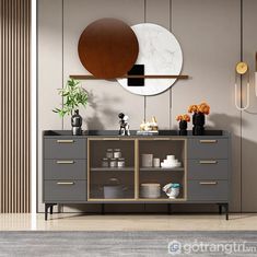 a modern bathroom with grey cabinets and gold accents