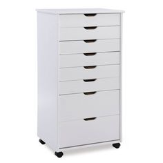 a white dresser with five drawers on wheels