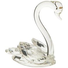 a crystal swan figurine on a white background