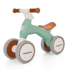 a wooden tricycle with two wheels and an orange handlebar