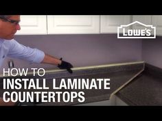 a man is installing laminate countertops in his kitchen