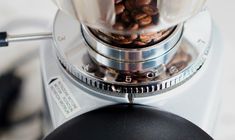 a blender filled with lots of nuts on top of a counter