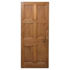 a wooden door with four paneled panels