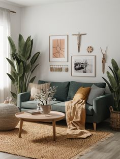 a living room filled with furniture and plants