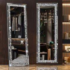 two mirrored mirrors in the middle of a room