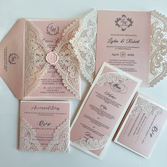 pink and white wedding stationery with lace