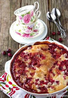 a pie with cranberry sauce in it on a wooden table