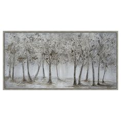 a painting with trees in the snow on a white wall above it is a black and white photo